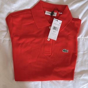 Lacoste women’s regular fit Polo in bright orange! 34